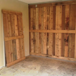 unfinished wooden slat door in room that is under construction